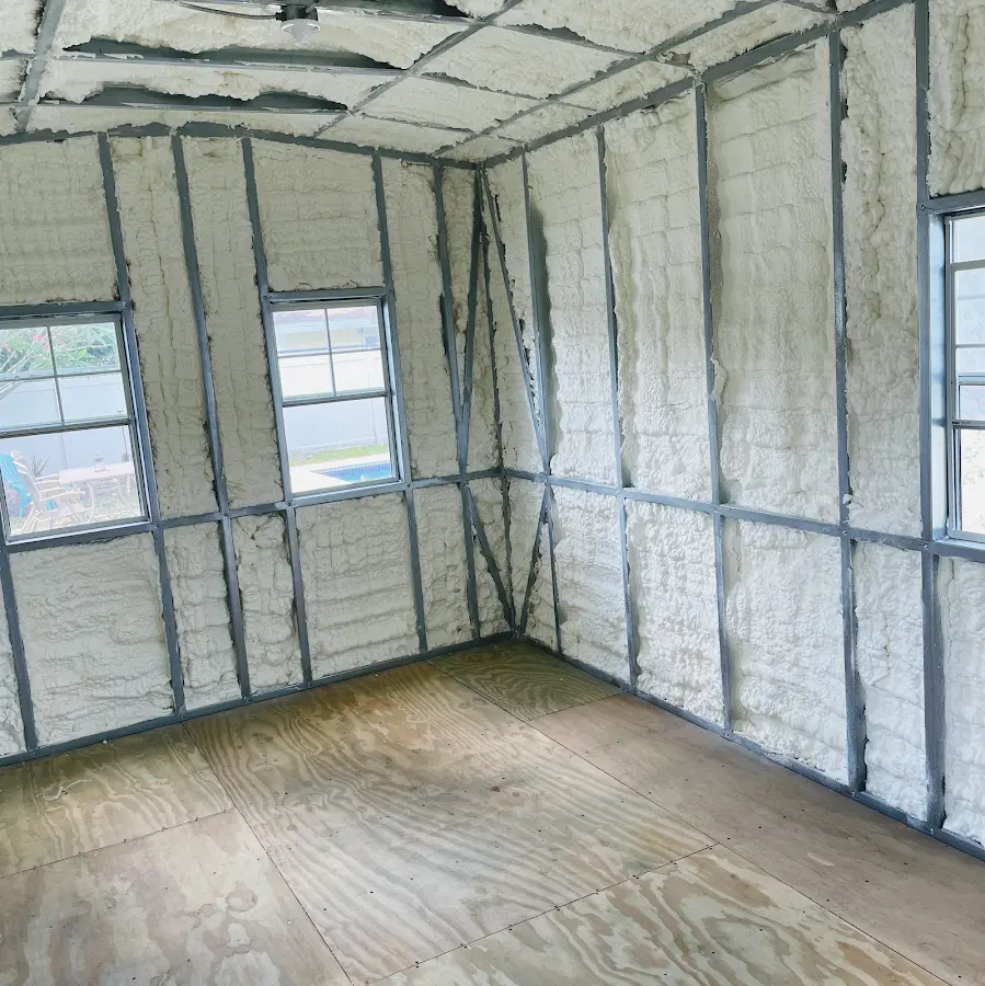Closed-cell spray foam insulation applied to wall cavities in a residential project in Lansing
